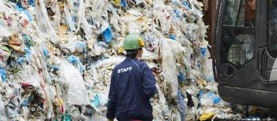 Workers at an industrial waste treatment facility.